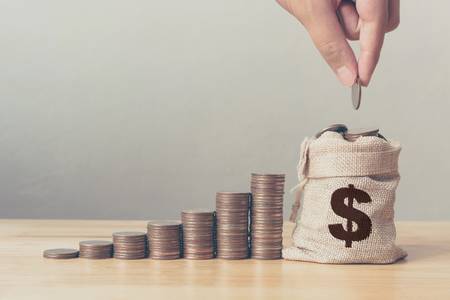 A person putting money in a coin purse